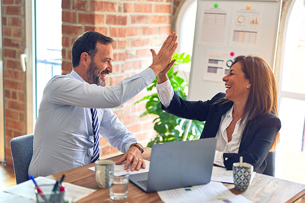 two people high fiving